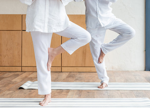 Two people doing yoga