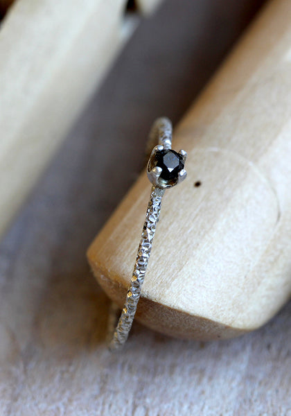 simple black diamond solitaire ring