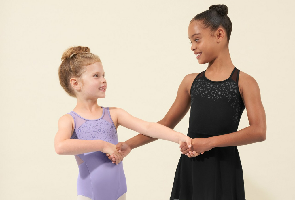 Two Girls Holding Hands Wearing Bloch Ballet Outfits