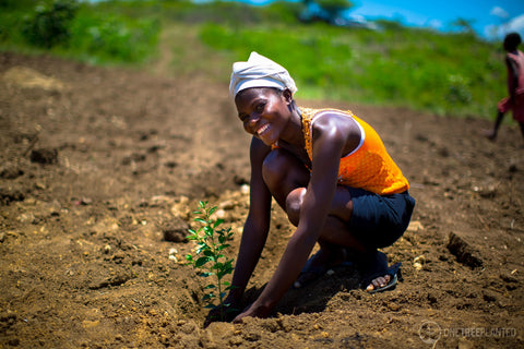 One Tree Planted lady planting with a beautiful smile