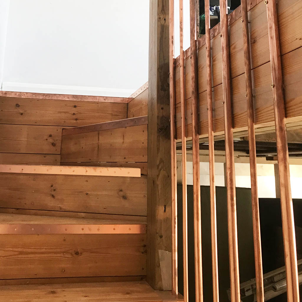 copper banister rails and copper stair rods