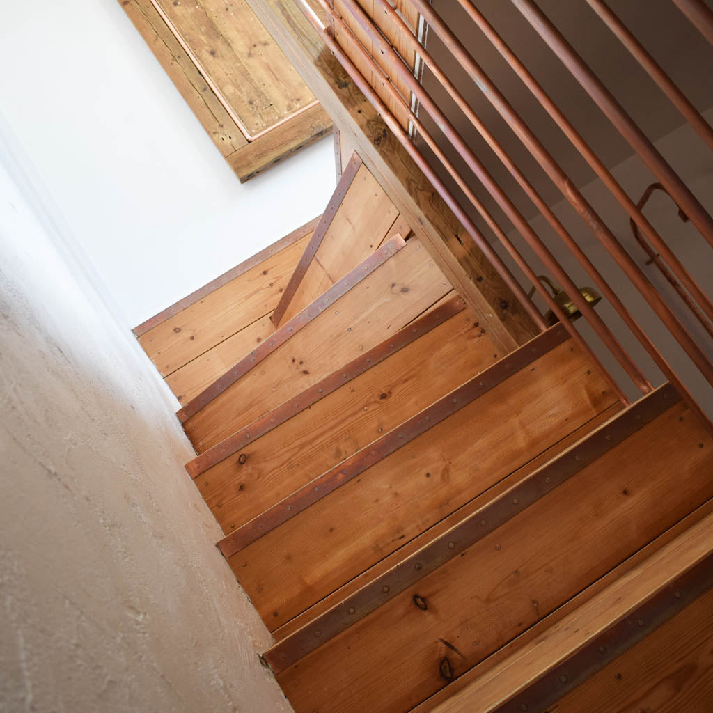 reclaimed staircase with copper trim