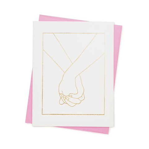 card with holding hands design