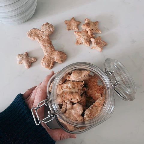 open jar of bacon and almond butter dog biscuits