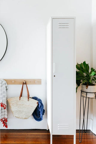 how to make the most of a small room - mustard made the skinny locker inbetween hanging rack and potted plant