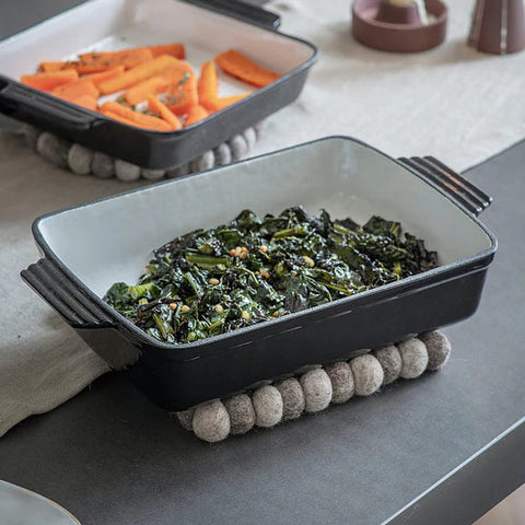 Cooked spinach in a ceramic tray