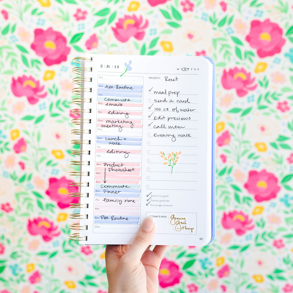 Cultivate Fresh Start Daily planner page on a floral background