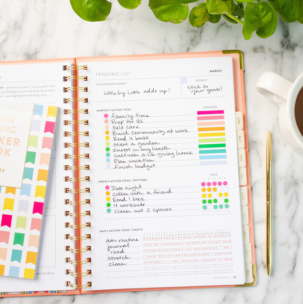 Colorful PowerSheets goal planner Tending List with rainbow stickers and sticker book