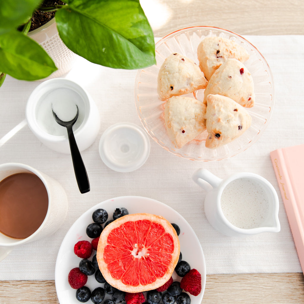 Coffee break with scones, fruit, and a gratitude journal