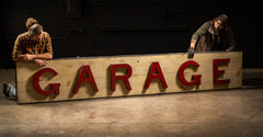 Massive Antique Garage sign with red letters and white background