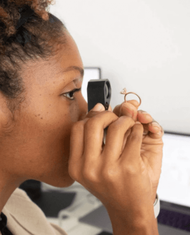 WHITE/SPACE founder, Khadijah inspecting diamonds