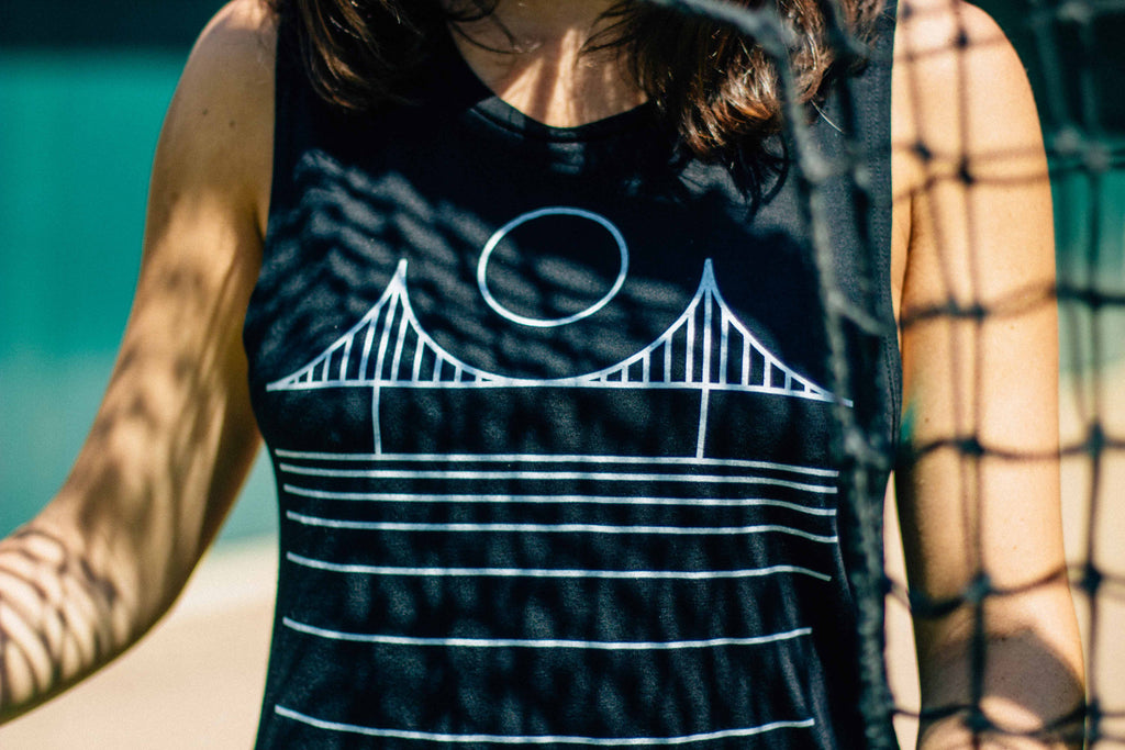 A close up of a black golden gate bridge muscle tank.