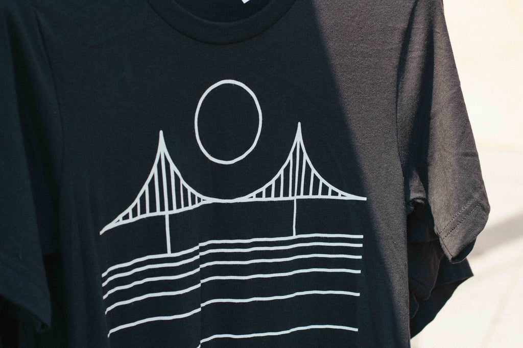 a tee shirt with a golden gate bridge graphic