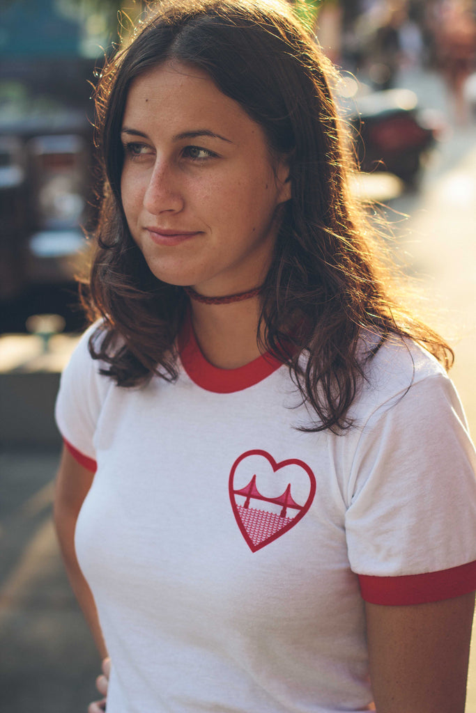 a girl wearing an i heart sf tee shirt