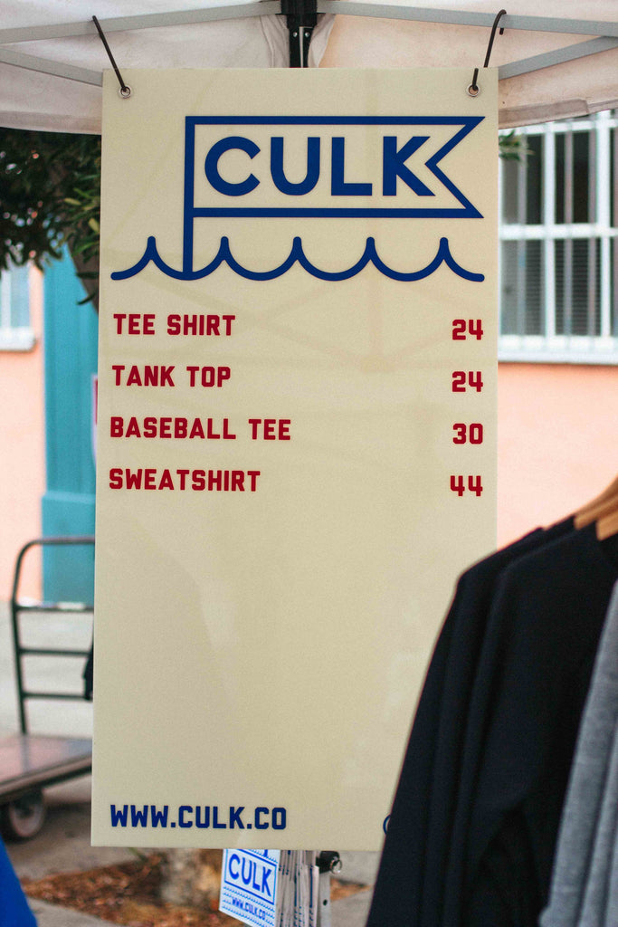 a sign with prices for culk items 