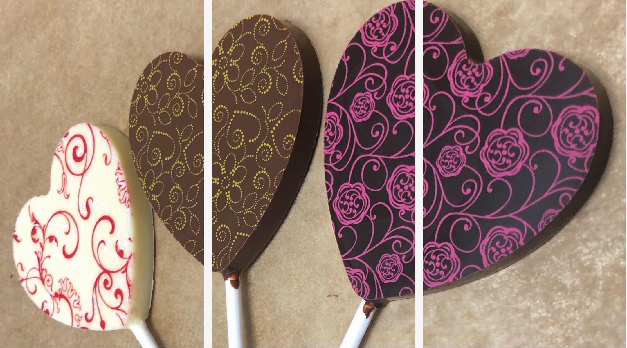 Three heart shapes lollipops with floral designs in white, milk, and dark chocolate