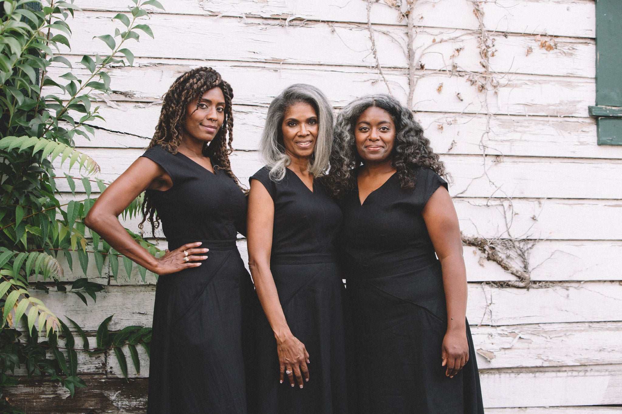 group of women in black xena dresses 