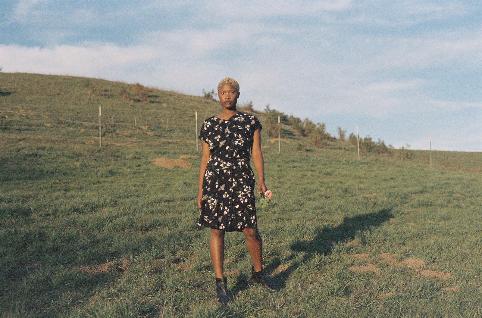 Woman in top and skirt with sphinx moths, sweet peas and jasmin