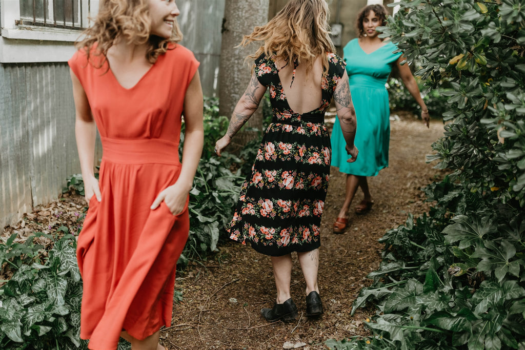 women dancing in backless dresses