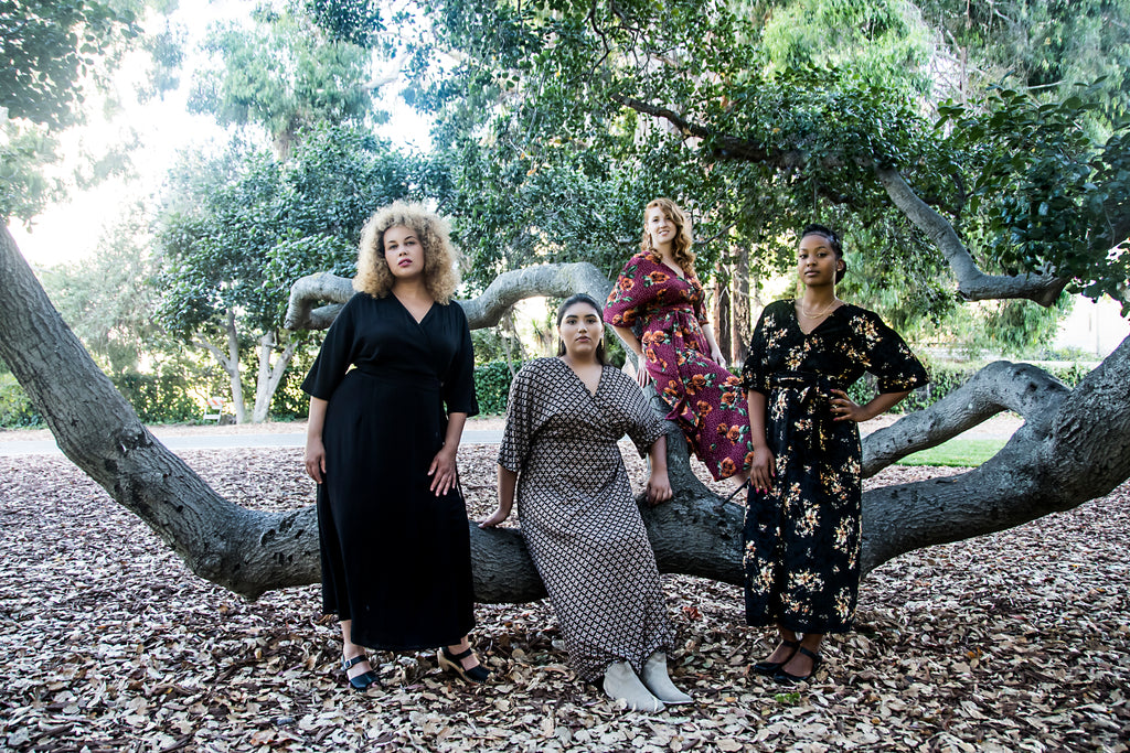 goddesses hang out in a oak tree in oakland wearing dresses 
