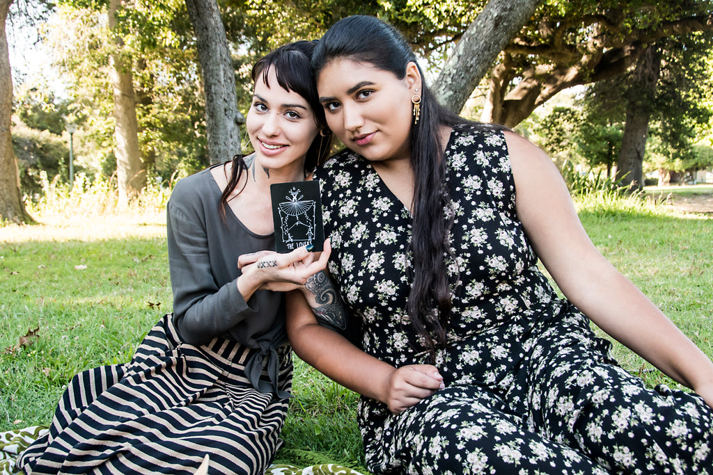 tarot card lovers with 2 women in field day dresses 