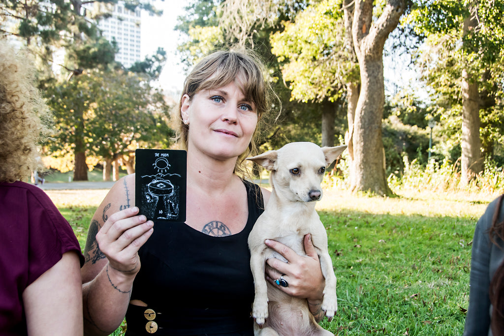 Field days shop owner wearing a black brigid tress with her dog mana 