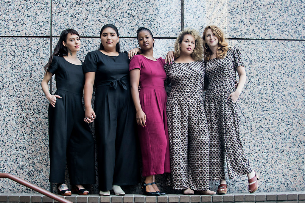 group of women wearing high waisted jumpsuits 