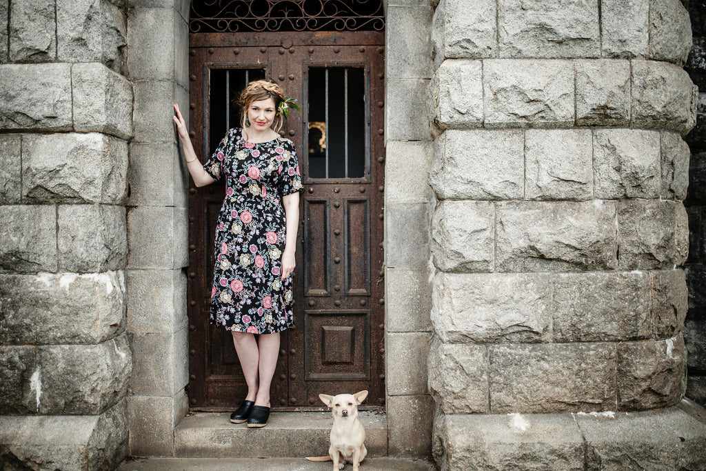 black floral cross over dress cute dog pretty lady with dress on 