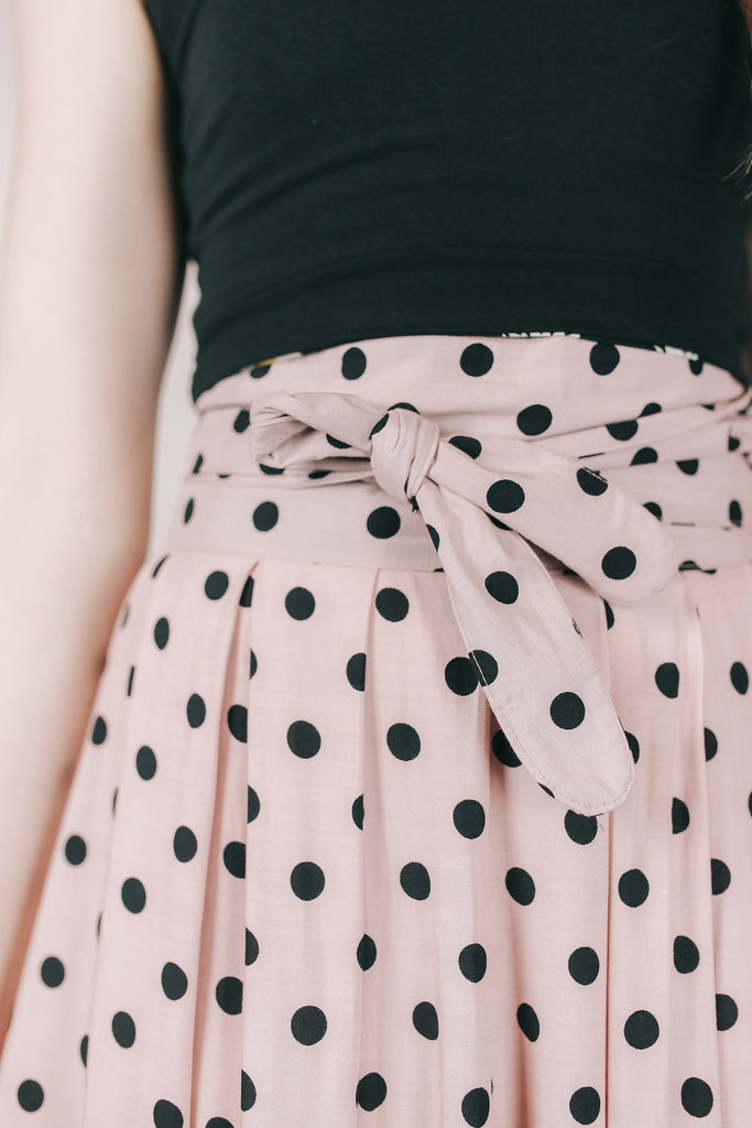 pink dress with black polka dots