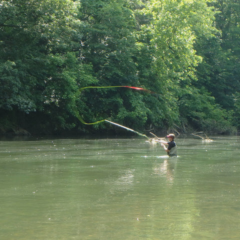 Learning to cast a fly rod in a Murray's Fly Shop Fly Fishing School on the water