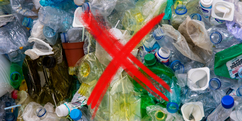 Image depicting plastic pollution with a prominent red 'X' symbol, suggesting the need to choose eco-friendly alternatives for a greener future.