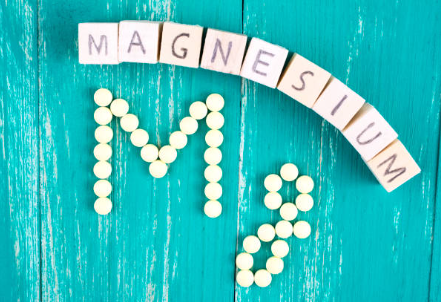 Word 'Magnesium' spelled out using magnesium tablets.