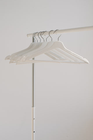 Empty white coat hangers