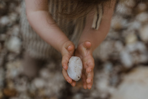 little law girl holding stone