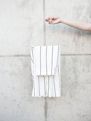 linen-trousers-minimal-white-linen-coat-hanger-hanging-pants