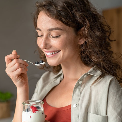 img of a woman eating yogurt