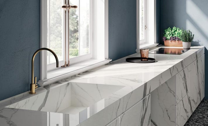 Porcelain slab countertops in kitchen look like marble