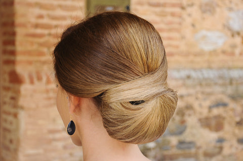 a woman with a beautiful chignon hair style