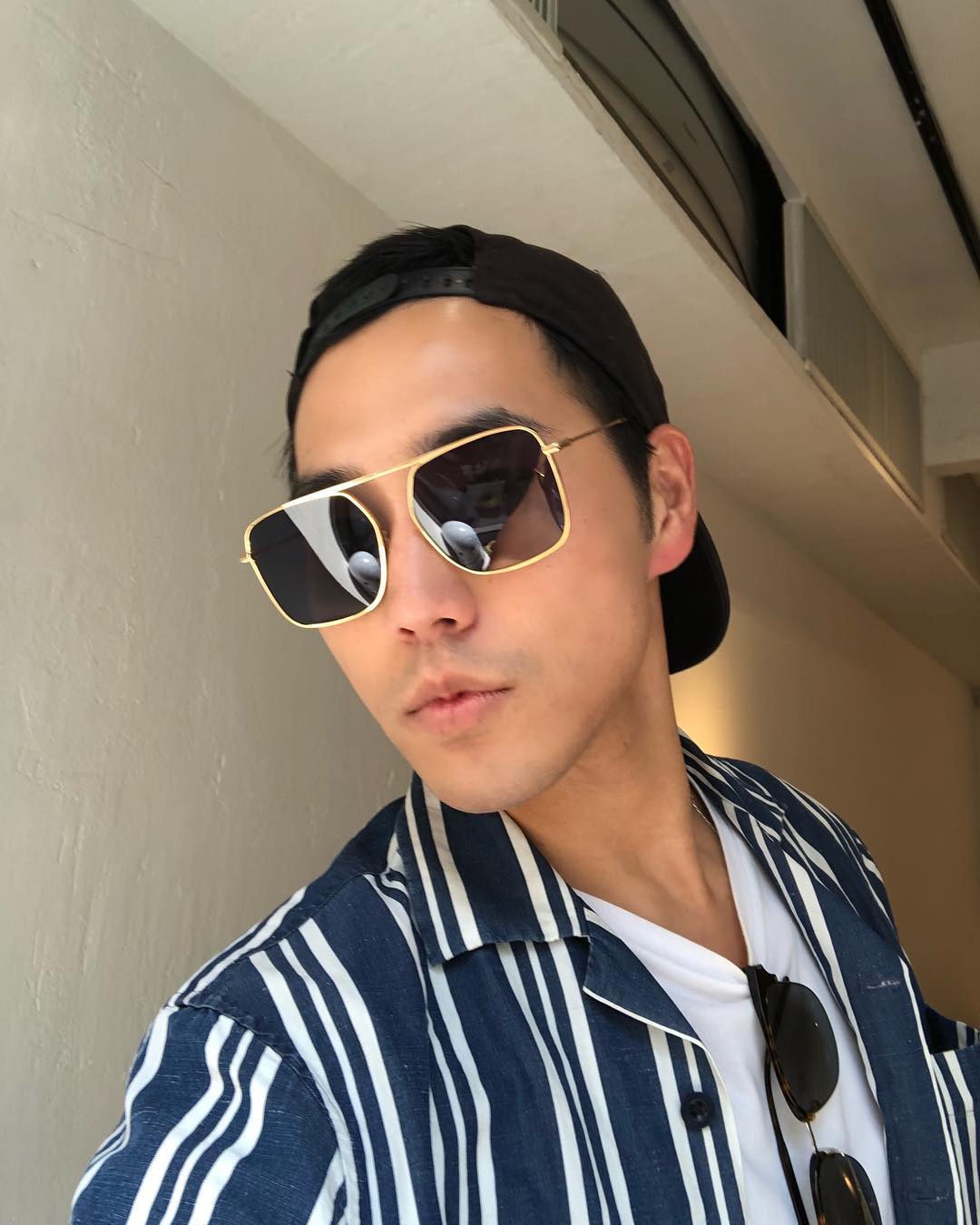 Fashionista Calvin Wang wears REVE by RENE BPM square aviator sunglasses