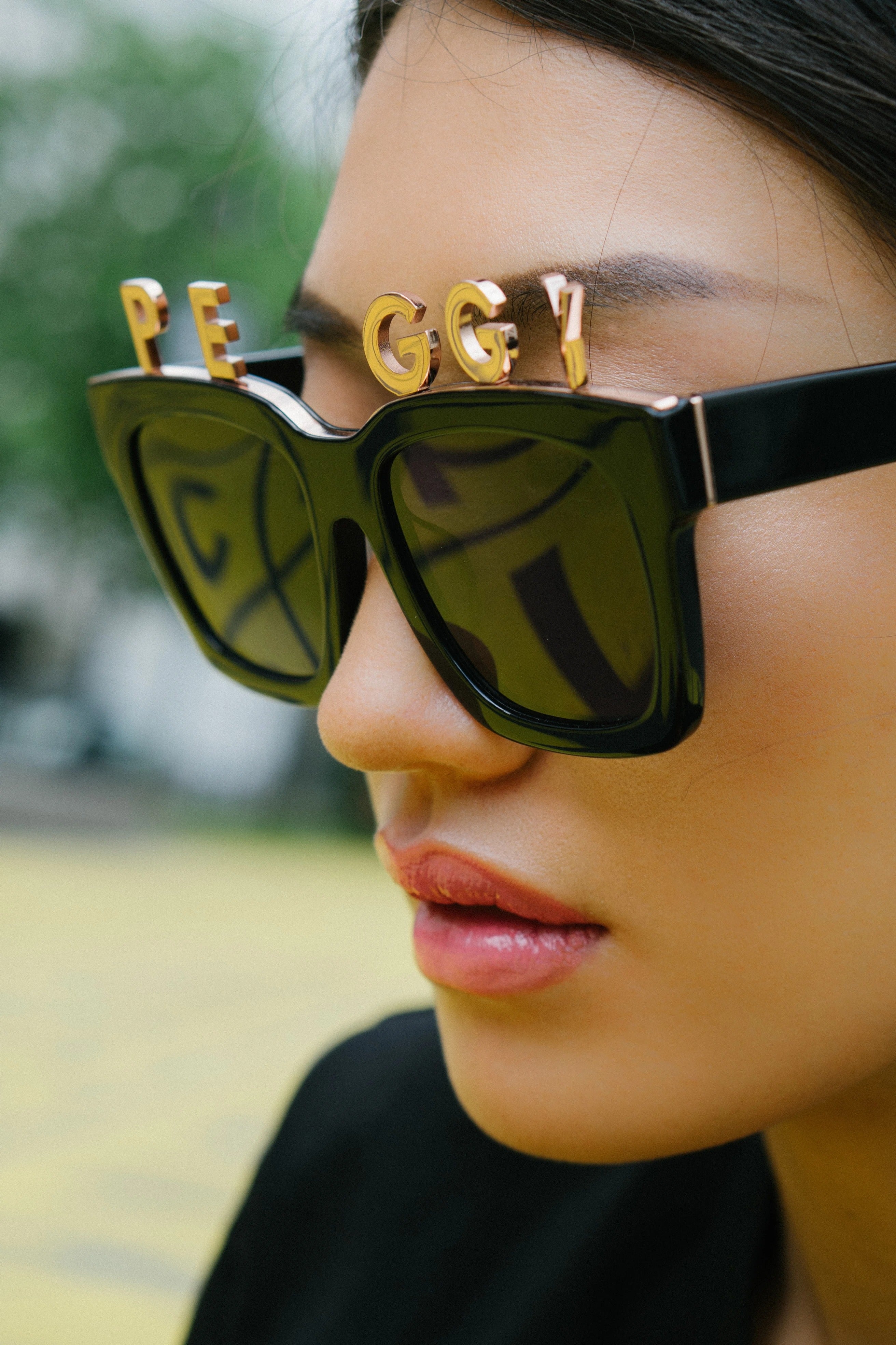 DJ Peggy Gou wears REVE by RENE alphabet sunglasses