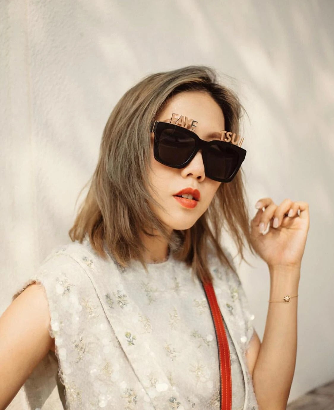 Fashion blogger Faye Tsui wears REVE by RENE alphabet sunglasses