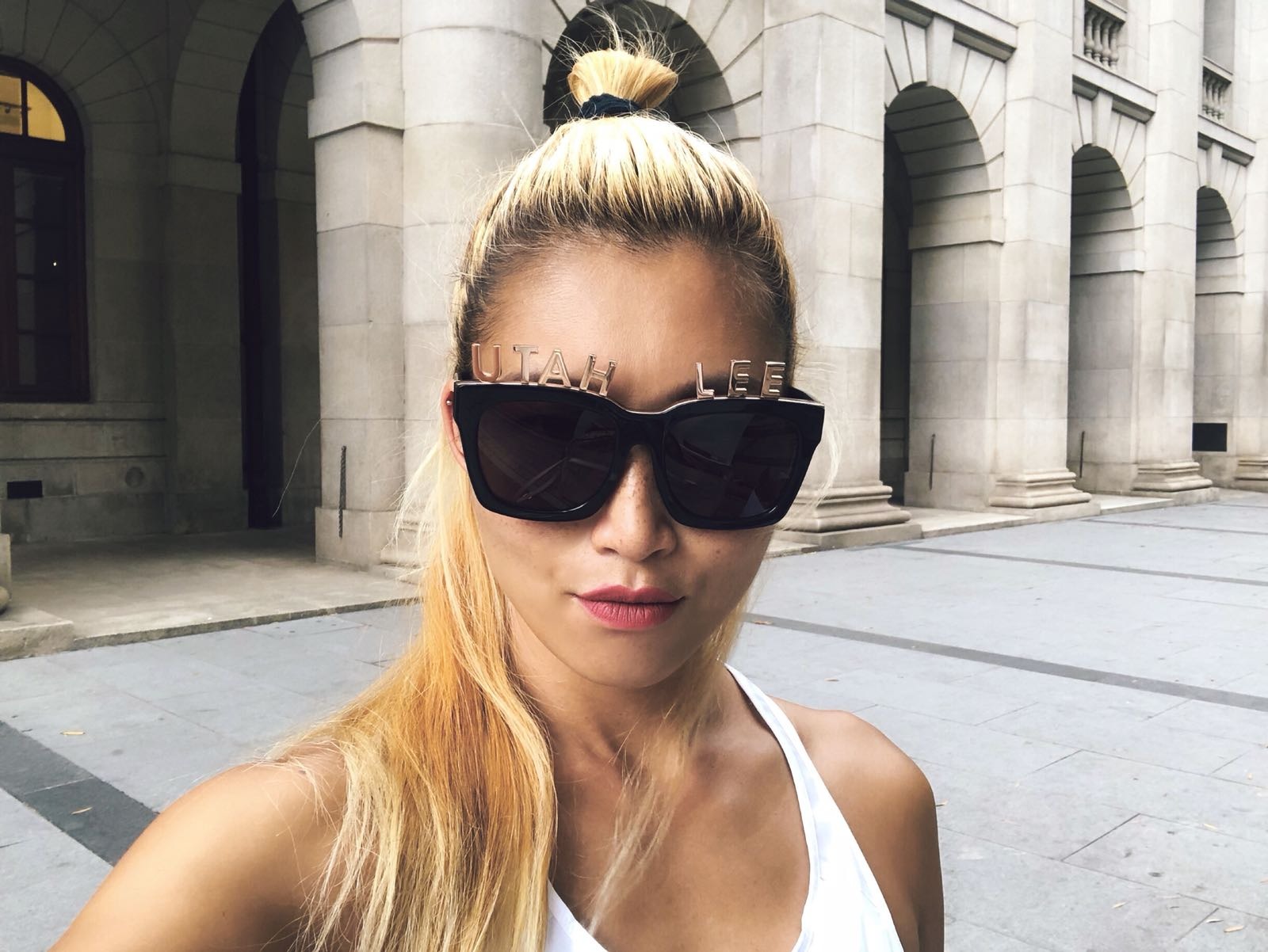 Utah Lee wears REVE by RENE alphabet Sunglasses