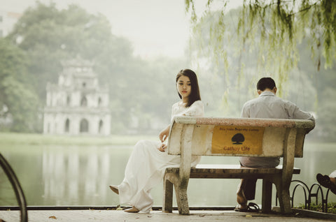 couple together on a bench