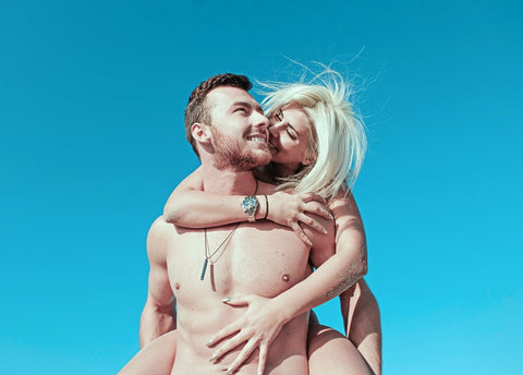 Couple enjoying on sunny beach
