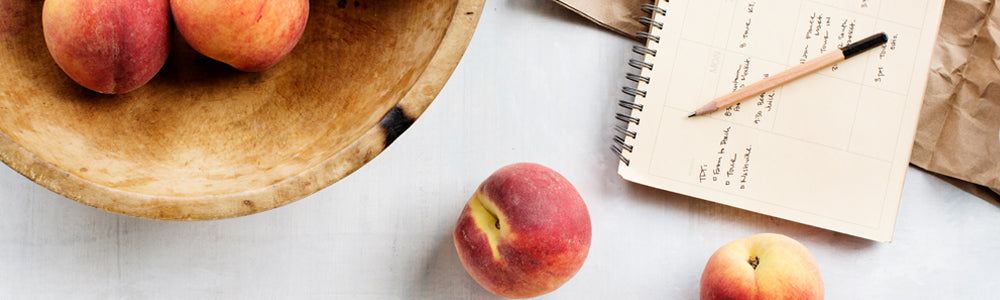 Peaches in a wooden bowl