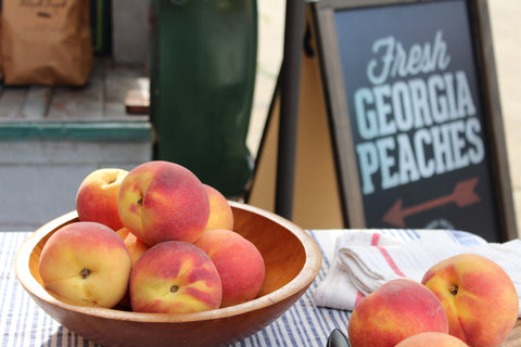 Peaches in a bowl at an event with The Peach Truck