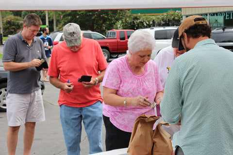 Customers waiting in line to get their peaches