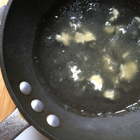 The sugar and gelatin starting to mix in the pan