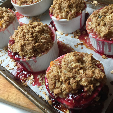 Completed peach and berry crumble in single serve cups