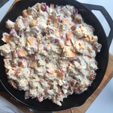 The bread pudding mixture put into a cast iron pan